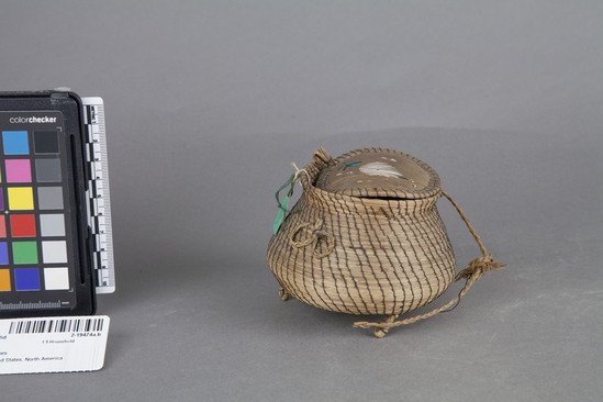 Hearst Museum object 2 of 2 titled Basket with lid, accession number 2-19474a,b, described as Pine needle coiling, birchbark bottom and cover.