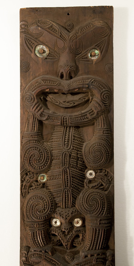 Hearst Museum object titled Carved pillar, accession number 11-2251, described as Finely large carved pillar of tōtara wood from carved meeting house, designed to hold the lower end of a rafter.