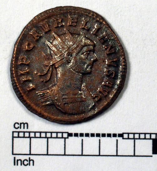 Hearst Museum object titled Coin: billon antoninianus, accession number 8-4058, described as Coin; Billon; Antoninianus; Roman. 3.07 grams, 22 mm. Aurelian, 270-275 AD. Pavia, Italy. Obverse: IMP AVRELIANVS AVG, Bust r. radiate. Reverse: PROVIDEN DEOR, Sol at r. salutes spirit of the military l.; in exergue SXXT