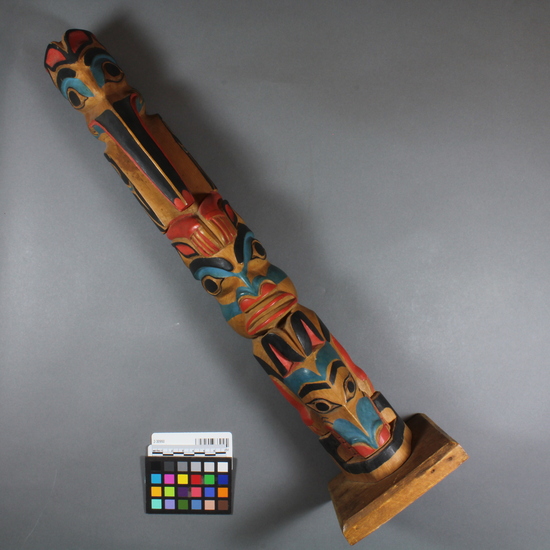 Hearst Museum object 3 of 4 titled Totem pole model, accession number 2-30950, described as Totem pole model. Painted red, blue, black; top to bottom: mosquito, probably a supernatural bear (Hootz), otter.  Deals with origin myth of Mosquito clan--see acc. envelope.