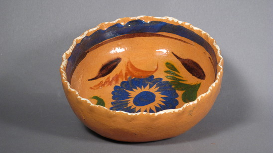 Hearst Museum object titled Bowl, accession number 3-30506, described as glazed and painted ceramic bowl; blue flower in center, green leaves and blue interior rim; scalloped rim edge.