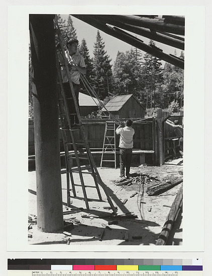 Hearst Museum object titled Black-and-white negative, accession number 15-19360, described as Fixing pulley to hoist rafter into position