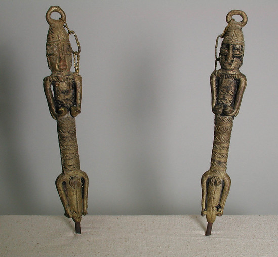 Hearst Museum object titled Figures, accession number 5-5334a,b, described as Newly cast, brass figures (Edan Ogboni) linked together. a. Female, elongated; H = 26.2 cm; b. Male; H = 25.7 cm