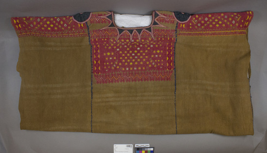 Hearst Museum object titled Huipil, accession number 3-145, described as Guipil (Brown cotton with some white weft stripes. Brocaded in red and orange cotton. Dark blue applique work at neck.)  For the color red, the fiber is cotton and the dye result is madder. For the color pink the fiber is silk and the dye result is probable synthetic.