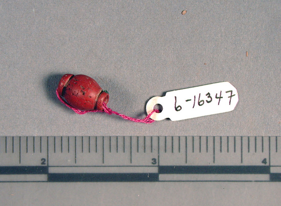 Hearst Museum object titled Bead, accession number 6-16347, described as Bead: 1 red, barrel-shaped.