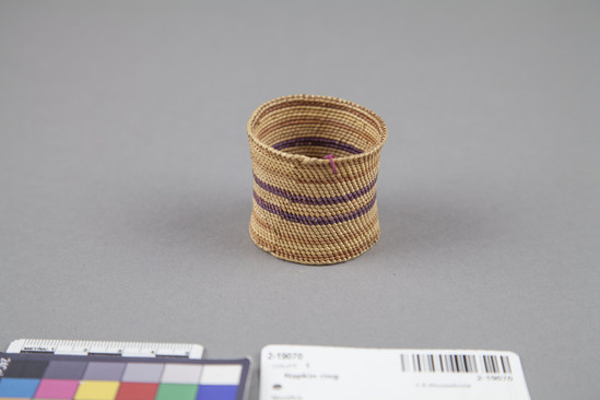 Hearst Museum object 3 of 3 titled Napkin ring, accession number 2-19070, described as Spiral lattice weave; red-brown, purple, and yellow horizontal bands.