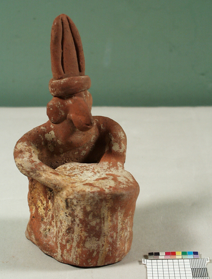 Hearst Museum object 1 of 2 titled Figurine, accession number 3-3596, described as Red pottery effigy of man playing drum