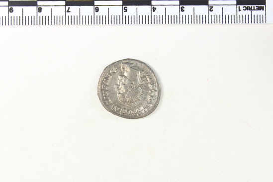Hearst Museum object 5 of 8 titled Coin: ar antoninianus, accession number 8-4370, described as Coin; Billon; Antoninianus; Roman. 4.22 grams, 23 mm. Trajan Decius, 249-251 AD. Obverse: IMP TRAIANV DECIVS AVG, bust r. radiate. Reverse: GENIVS EXERCITVS ILLVRICIANI, genius standing l., military standard at r.