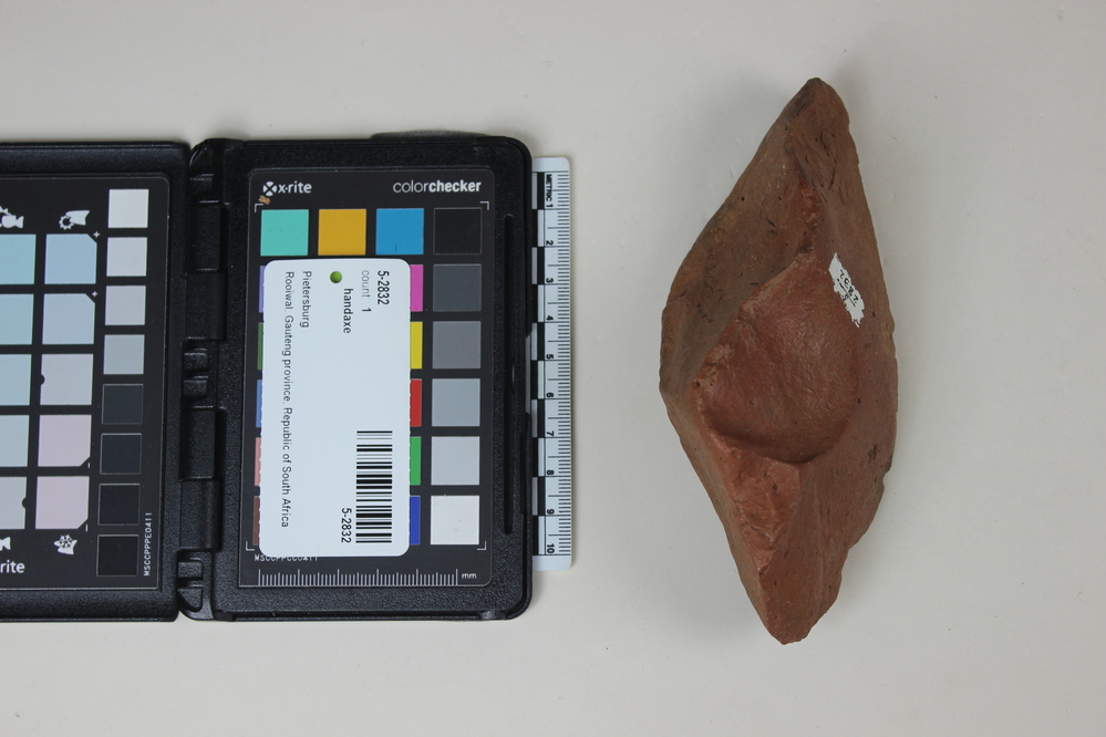 Hearst Museum object titled Handaxe, accession number 5-2832, described as Pietersberg Culture, MSA; sandstone bifacially flaked hand axe. “S” twist on on edge; Mid-late Pleistocene gravels.