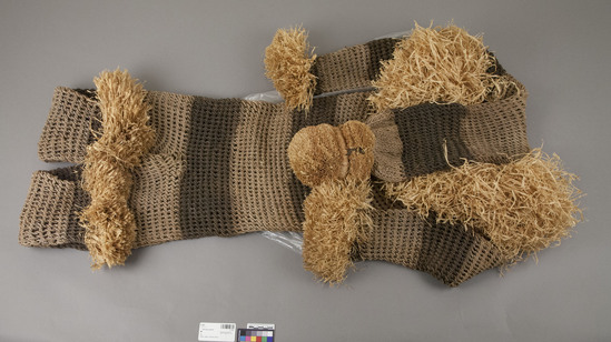 Hearst Museum object 3 of 3 titled Dancing costume, accession number 5-1953, described as Dance costume; cordage; looped technique- raffia trim; 78 inches length; 51 inches wide.