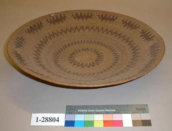 Hearst Museum object titled Basket, accession number 1-28804, described as Coiled, single rod.  Red concentric design, flaring.