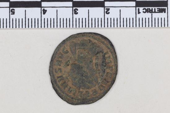 Hearst Museum object 2 of 8 titled Coin: billon antoninianus, accession number 8-6012, described as Coin: Antoninianus; AR [?], Æ; Aurelianus - 3.03 grams. Obverse: IMP C AVRELIANVS AVG - Bust facing right radiate, cuirassed. Reverse: CONCORDIA MILITVM -  Emperor and Concordia clasping hands, [untranscribable symbols].