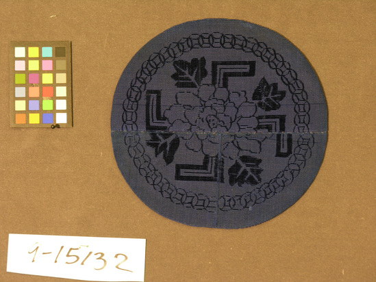 Hearst Museum object titled Lined piece, accession number 9-15132, described as Lined piece, round. Cut and uncut pile, plain weave lining. Blue, blue green lining. Peony, swastika, geometric motives. 8 inch diameter.