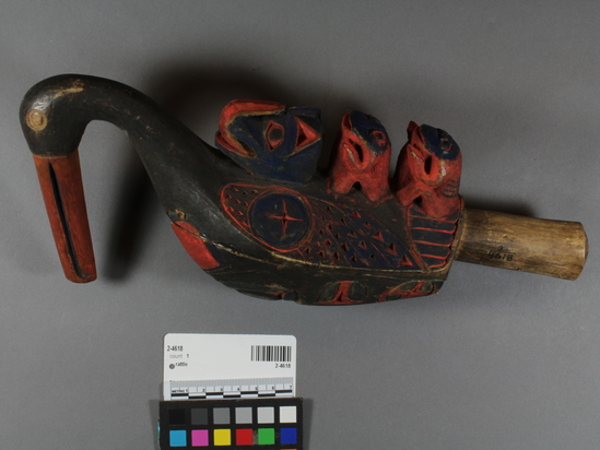 Hearst Museum object 3 of 4 titled Rattle, accession number 2-4618, described as Bird shaped (loon with otter and 2 frogs on back); carving of sparrow hawk on underside; painted red, blue and black.