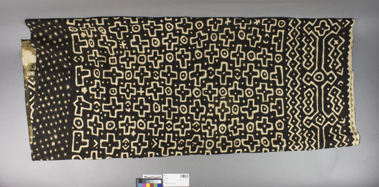 Hearst Museum object titled Textile, accession number 5-8795, described as Cotton cloth; 12 cm. wide strips of plain weave (8) sewn together; off-white geometric designs on black ground; l. 160 cm; w, 100 cm.