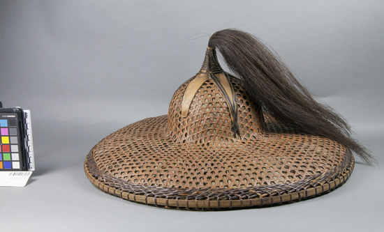 Hearst Museum object titled Hat, accession number 10-170a, described as a) Hat; rattan and fibre; star on crown; hair tassel; nito trim; 18½ inch diameter. b-d) Head bands; coiled; bamboo and rattan.