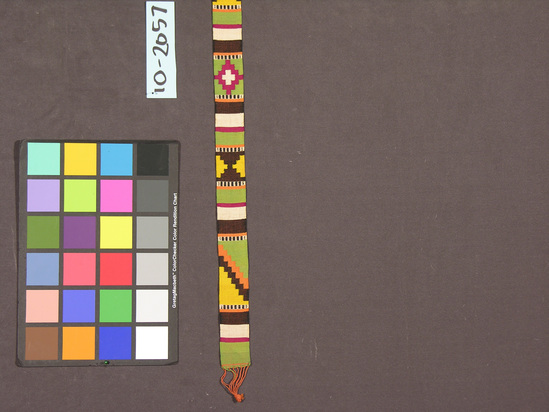 Hearst Museum object titled Belt, accession number 10-2057, described as Tapestry belt; cotton; weft face; multicolored geometric designs; warps; fringe; 63 inches by 1½ inches