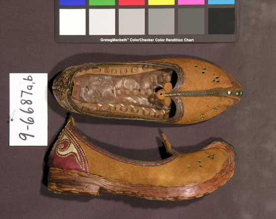 Hearst Museum object titled Shoes, accession number 9-6687a,b, described as Man’s pointed toe leather shoes; stitched-on decorations; length 11 inches.