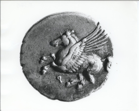 Hearst Museum object 11 of 11 titled Coin: ar stater, accession number 8-5485, described as Coin; AR; Stater; Greek. 8.5435 grams, 21.7 mm.  400-338 BC. Corinth, Greece. Obverse: Pegasus with pointed wings flying l.; below, Ϙ. Reverse: Head of Pallas l. helmeted; to left, “I”; to right, Nike flying l. carrying fillet. Remarks: "condition, excellent.