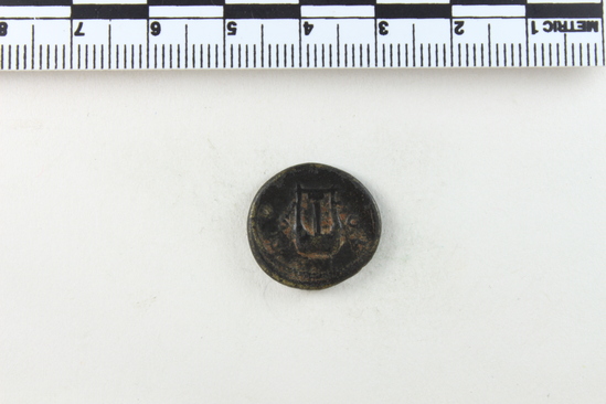 Hearst Museum object 12 of 14 titled Coin: æ semis, accession number 8-8133, described as Coin; Æ; aes grave; semis; Orichalcum. 3.751 grams. Obverse: Head of Hadrian, facing right. Reverse: S C flanking object.