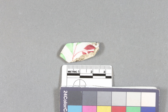 Hearst Museum object titled China fragment, accession number 1-120258, described as China fragment, red and green leaves design, curved piece