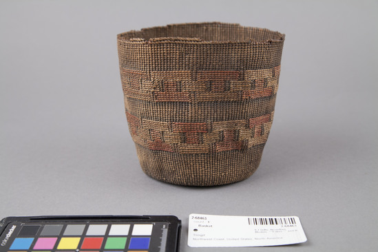 Hearst Museum object 3 of 3 titled Basket, accession number 2-68463, described as Round with concave bottom, straight sides, 2 bands of geometric false embroidery, colors faded, badly stained throughout, edge broken in several areas. Spruce root, grass stems, dyed, plain twined.