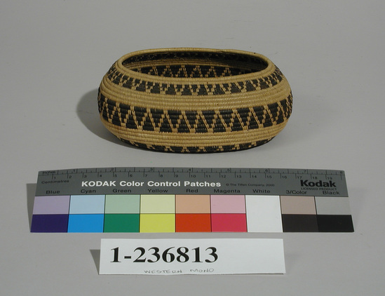 Hearst Museum object titled Basket, accession number 1-236813, described as Coiled. Oval shape. 4 horizontal bands of opposing triangles in black. Grass bundle foundation, sewing strands of sedge and bracken fern roots.