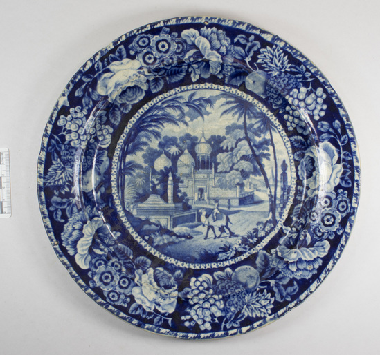 Hearst Museum object titled Plate, accession number 7-1827, described as Dark blue printed Staffordshire: 10'' dia. plate; bottom mark blue" "Oriental Mahomedan Mofquef Tomb scenery  Hall & Sons