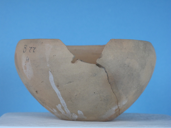 Hearst Museum object 18 of 48 titled Broken bowl, accession number 6-5108, described as Pottery: buff bowl, broken 5 small holes, slow ancient repairing; diameter 14 cm, height 8 cm.