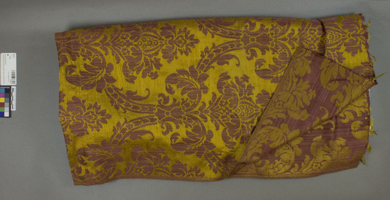 Hearst Museum object titled Textile, accession number 2-62511, described as Yardage; damask, red ground and yellow designs, floral and leaf motives