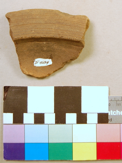 Hearst Museum object titled Potsherd, accession number 5-5094, described as Brown rim sherd; flattened rim with incised lines; length 8 cm