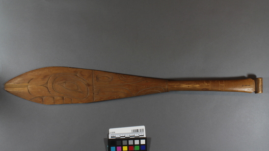 Hearst Museum object titled Paddle, accession number 2-14144, described as Small, wooden, with animal designs. "Sitka" carved on handle.