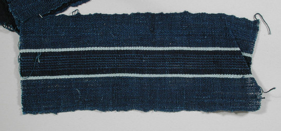 Hearst Museum object titled Textile fragment, accession number 5-11070, described as Textile sample (section of narrow band weaving): dark royal blue ground with central navy stripe intersected by six lines bright blue and flanked by pale blue stripes.