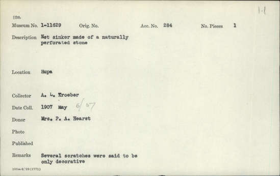 Documentation associated with Hearst Museum object titled Sinker (fishing), accession number 1-11629, described as Net sinker made of a naturally perforated stone. Several scratches were said to be only decorative.