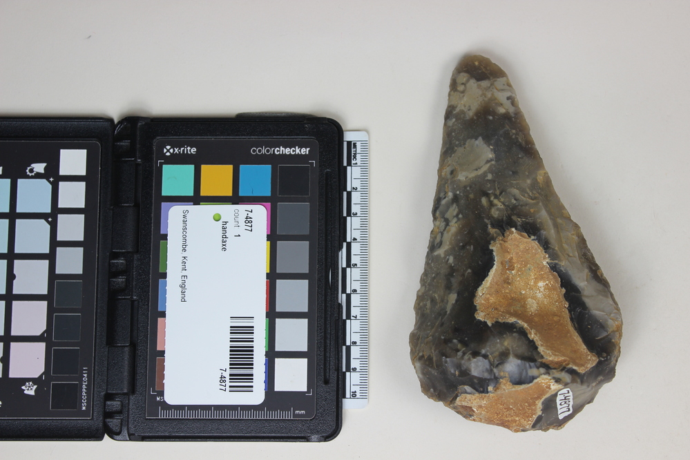 Hearst Museum object titled Handaxe, accession number 7-4877, described as Acheulian Handaxe; dark grey flint