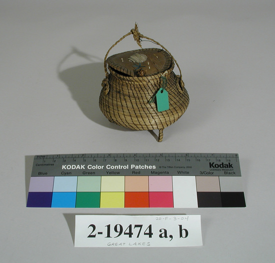 Hearst Museum object 1 of 2 titled Basket with lid, accession number 2-19474a,b, described as Pine needle coiling, birchbark bottom and cover.