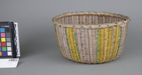 Hearst Museum object 2 of 2 titled Basket, accession number 10-1312, described as Wicker basket, painted green & yellow stripes; round; flat bottom; open mouth; 9 1/2” dia.