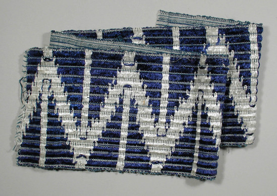 Hearst Museum object titled Textile fragment, accession number 5-11349, described as textile sample (section of narrow band weaving): blue and white silk or rayon brocade in a zig-zag pattern.