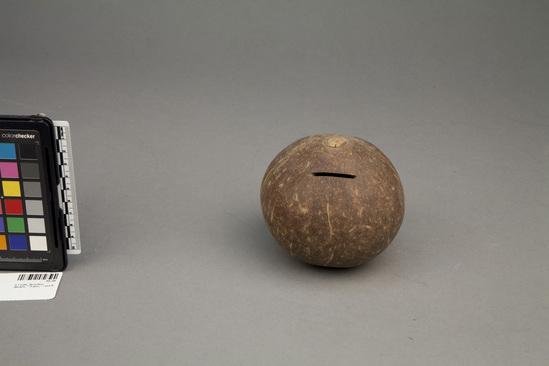 Hearst Museum object titled Coin bank, accession number 10-20, described as coconut shell bank; ca. 4.5 diameter