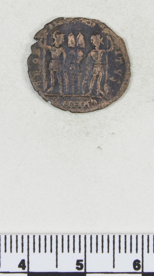 Hearst Museum object titled Coin: æ 3, accession number 8-7241, described as Coin AE 3 Reverse: 2 Standards between soldiers