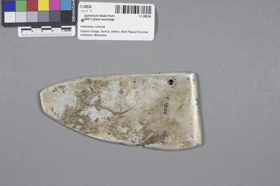 Hearst Museum object titled Adze, accession number 11-38534, described as Aluminum adze blade;  from WW II plane wreckage