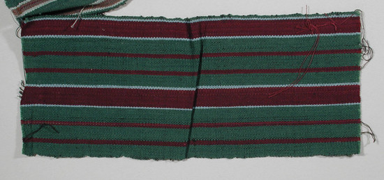 Hearst Museum object titled Textile fragment, accession number 5-11244, described as Textile sample (section of narrow band weaving): green ground with two wide maroon stripes flanked by pale blue, with four narrow maroon stripes.