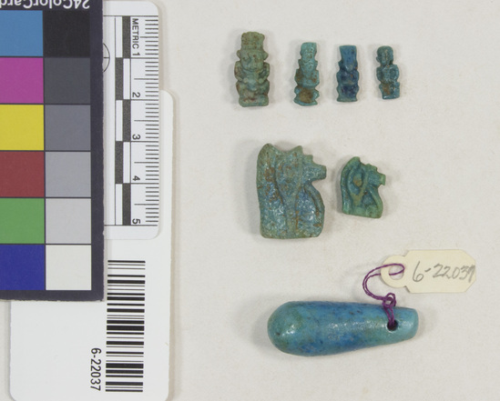 Hearst Museum object 9 of 22 titled Amulets, accession number 6-22037, described as amulets, of blue faience, and one pyramidal seal of steatite