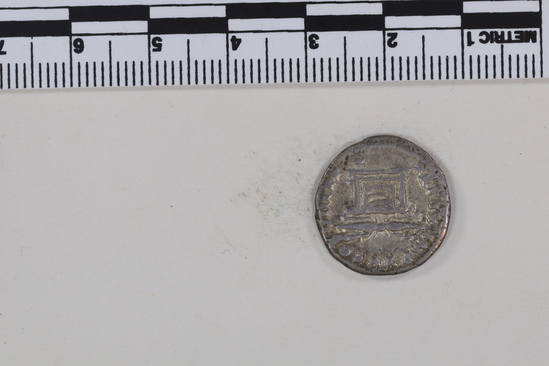 Hearst Museum object 4 of 8 titled Coin: denarius, accession number 8-5637, described as Coin. Roman. Denarius. (    gms.; 18 mm.) Titus, AD. 80, Rome. Obverse: IMP TITVS  CAES   VESPASIAN AVG  P M   Head facing right, laureate. Reverse: TR P IX   IMP XV  COS  VIII   P P   Winged thunderbolt on draped altar.