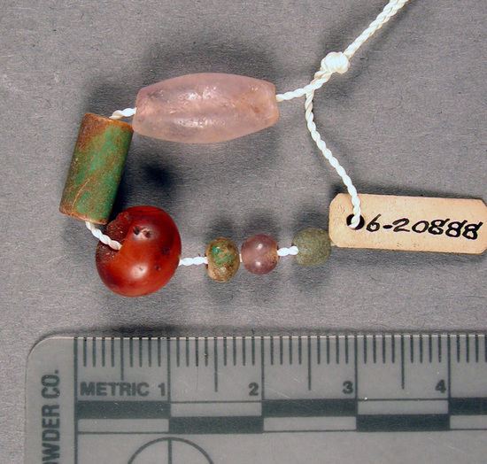 Hearst Museum object titled Mixed beads, accession number 6-20888, described as carnelian, amethyst, shell beads. Late Middle Empire