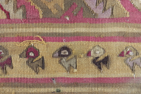 Hearst Museum object 4 of 5 titled Tapestry fragment, accession number 16-980, described as Fragment of heavy finely woven tapestry decorated with bird and step design