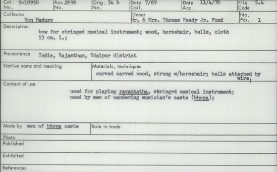 Documentation associated with Hearst Museum object titled Musical bow, accession number 9-10950, described as bow for stringed musical instrument; wood, horsehair, bells, cloth; Length 53 cm.