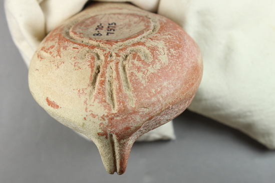 Hearst Museum object 3 of 12 titled Oil lamp, accession number 8-7575, described as Oil Lamp; orange, short stub, stamped with braid design