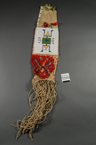 Hearst Museum object titled Pipe bag, accession number 2-19592, described as Pipe bag; white buckskin; multicolored beads on white bead ground; geometric designs; analine dyed quillwork on old parfleche material; fringed; red-dyed horsehair tassels.