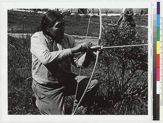 Hearst Museum object titled Black-and-white negative, accession number 15-6006, described as Ishi using bow to illustrate release